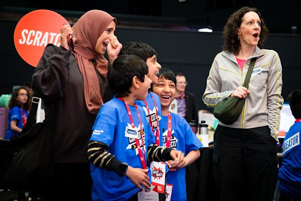 An image of two women and three children celebrating at Coolest Projects UK.