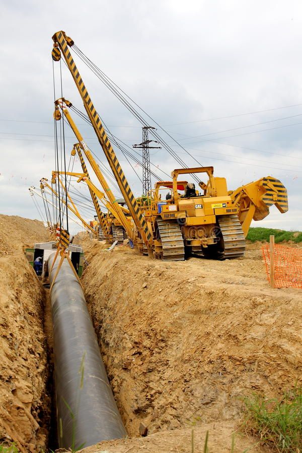 Cranes laying gas pipeline 