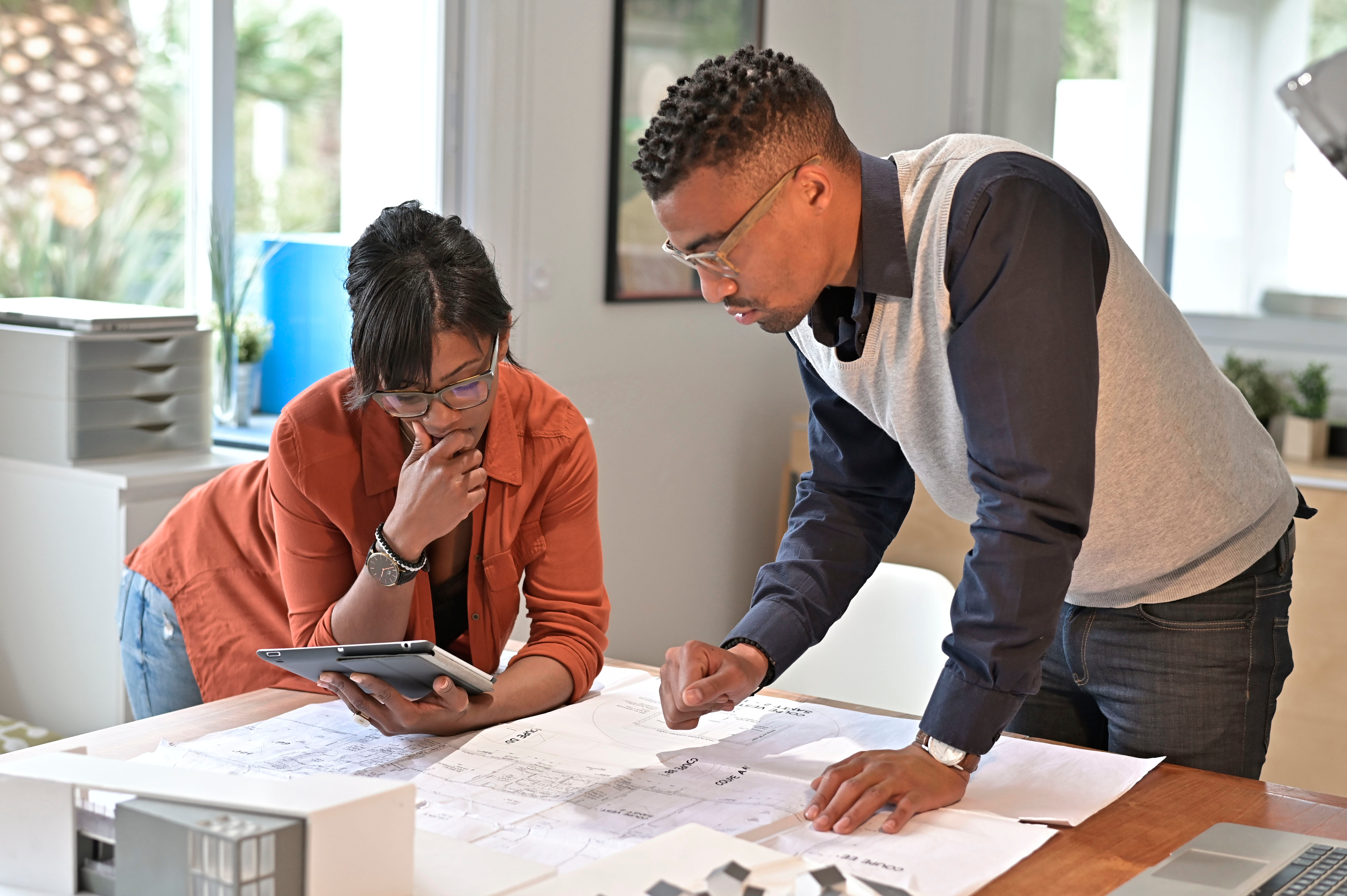 Architect with eco designer working on project in office - An image for Climate Adaptation into Business Continuity Planning
