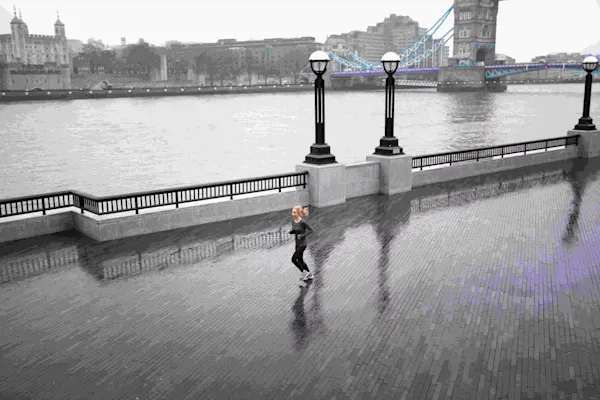 Woman running outside while it rains