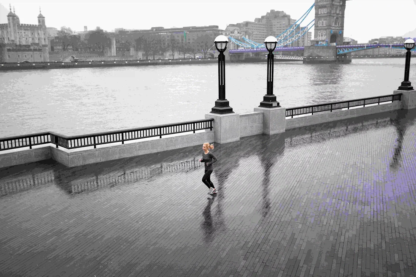 Woman running outside while it rains