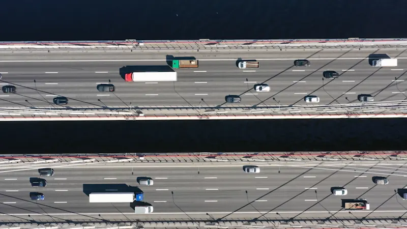 Integrating TCFD Recommendations into Existing Reporting. Aerial top view of cable-stayed bridge with cars in St.Petersburg
