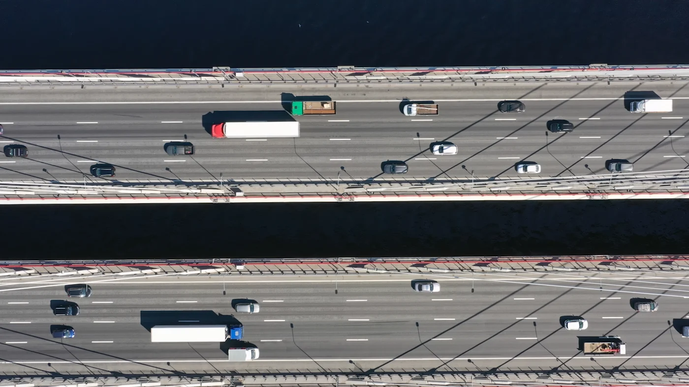 Integrating TCFD Recommendations into Existing Reporting. Aerial top view of cable-stayed bridge with cars in St.Petersburg