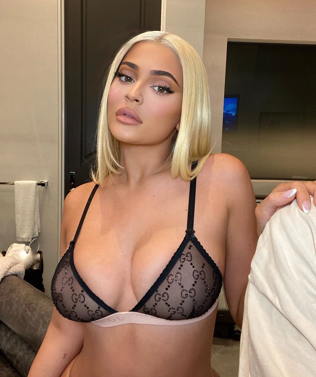 Kylie Jenner in a black bra.