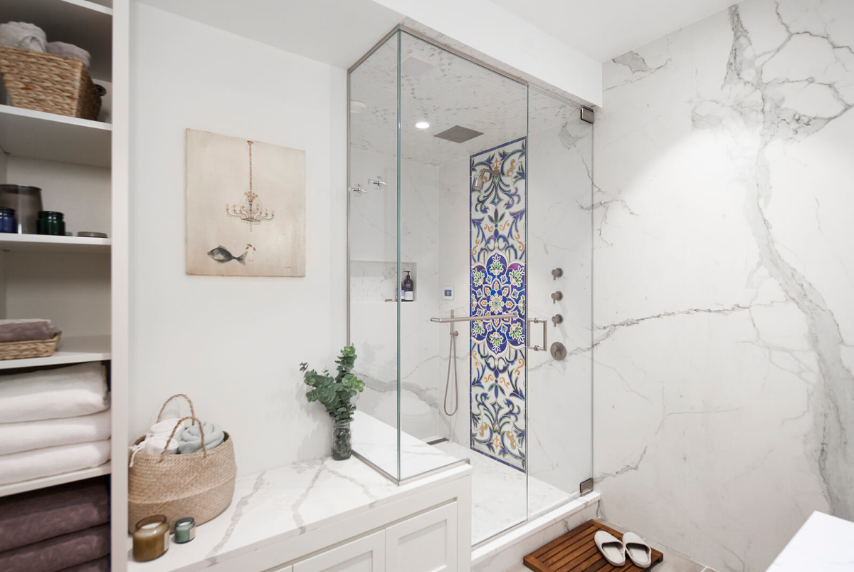 Park Slope Brownstone bathroom residential interior design renovation by Basicspace. Steam-shower bathroom with colorful mosaic art inlay, bench, built-in custom millwork and open shelving storage.