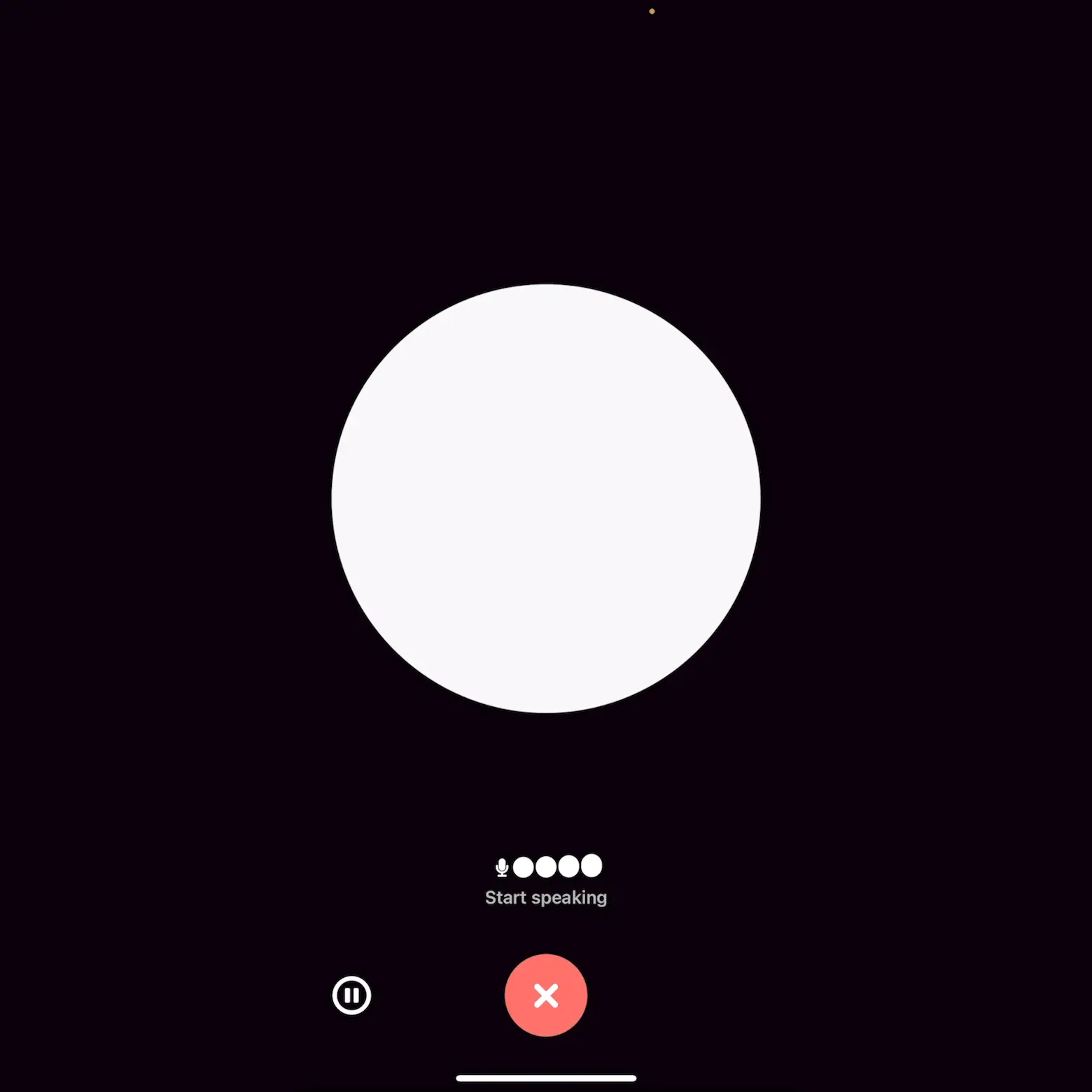Una pantalla de una aplicación móvil con un fondo oscuro y un círculo blanco en el centro. Debajo del círculo, hay un botón rojo con una "X" en el centro y una etiqueta que dice "Start speaking" junto a un icono de micrófono y cuatro puntos blancos. En la esquina inferior izquierda, hay un pequeño icono de pausa. Esta pantalla parece estar relacionada con la activación de una función de voz o grabación.