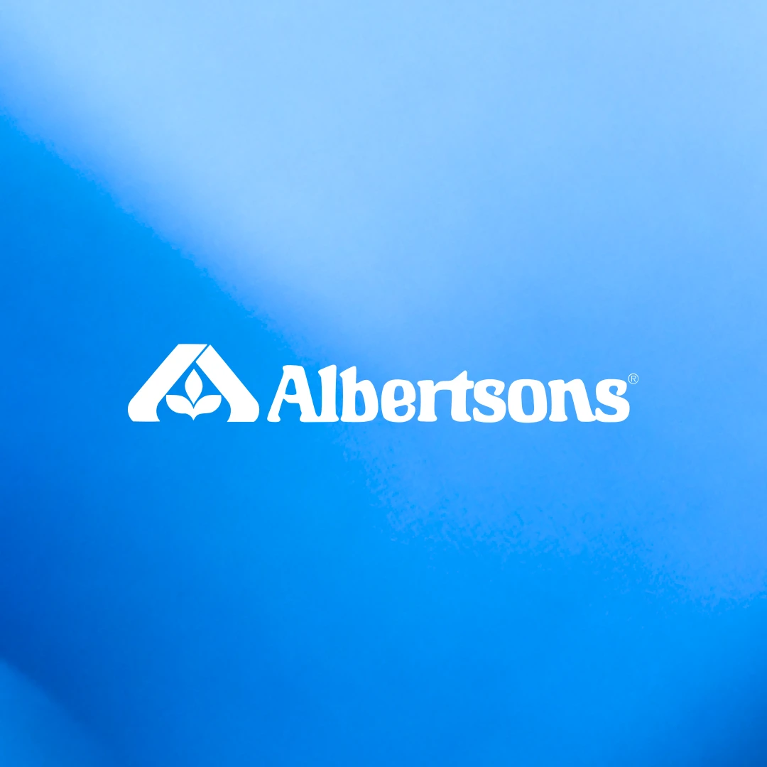 White Albertsons logo centered on blue abstract artwork.