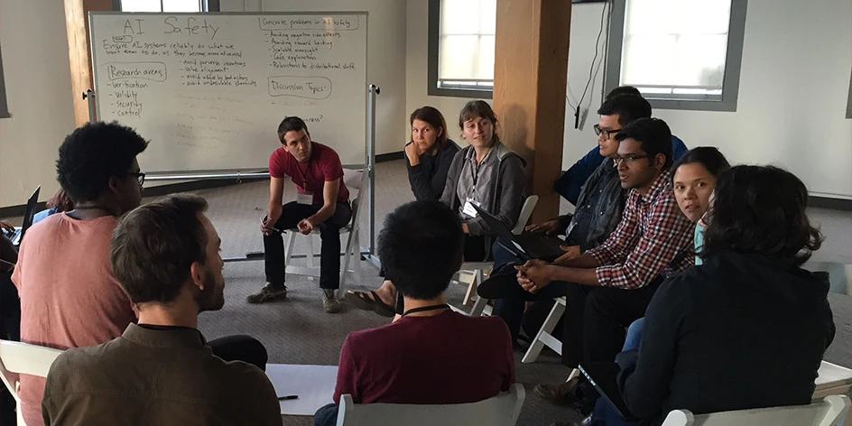 Group of people sitting in a circle talking