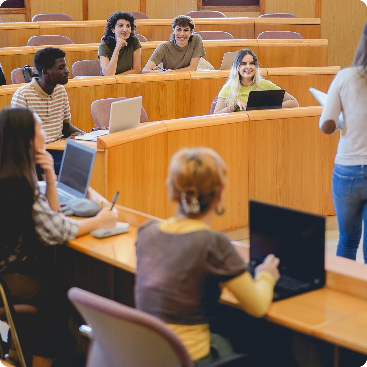Educators and students working together in a classroom.