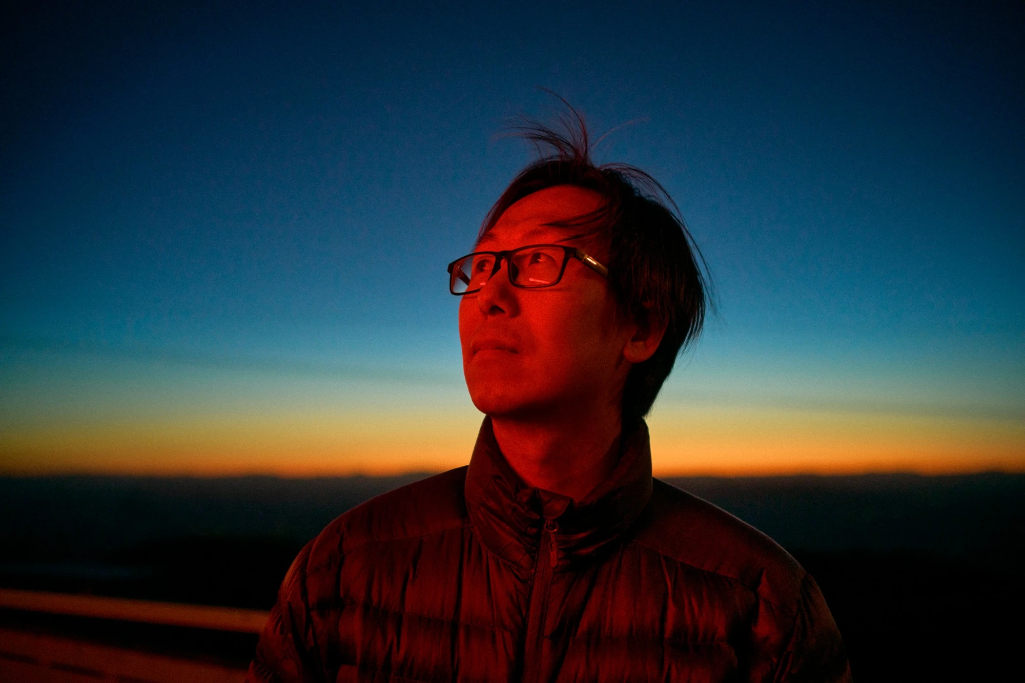 CK Chan outdoors at dusk.