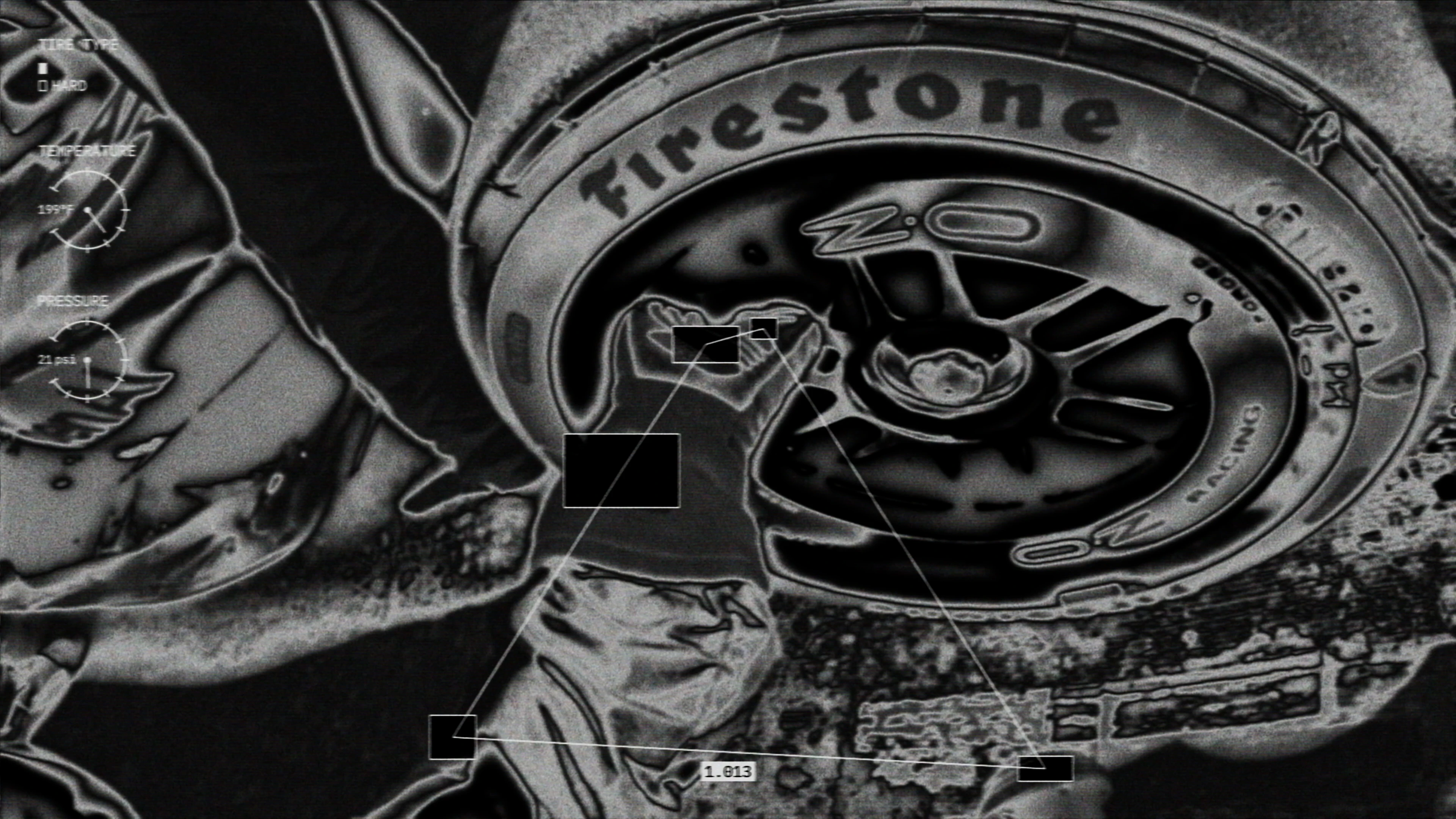 inverted image of a pit crew member working on a tire