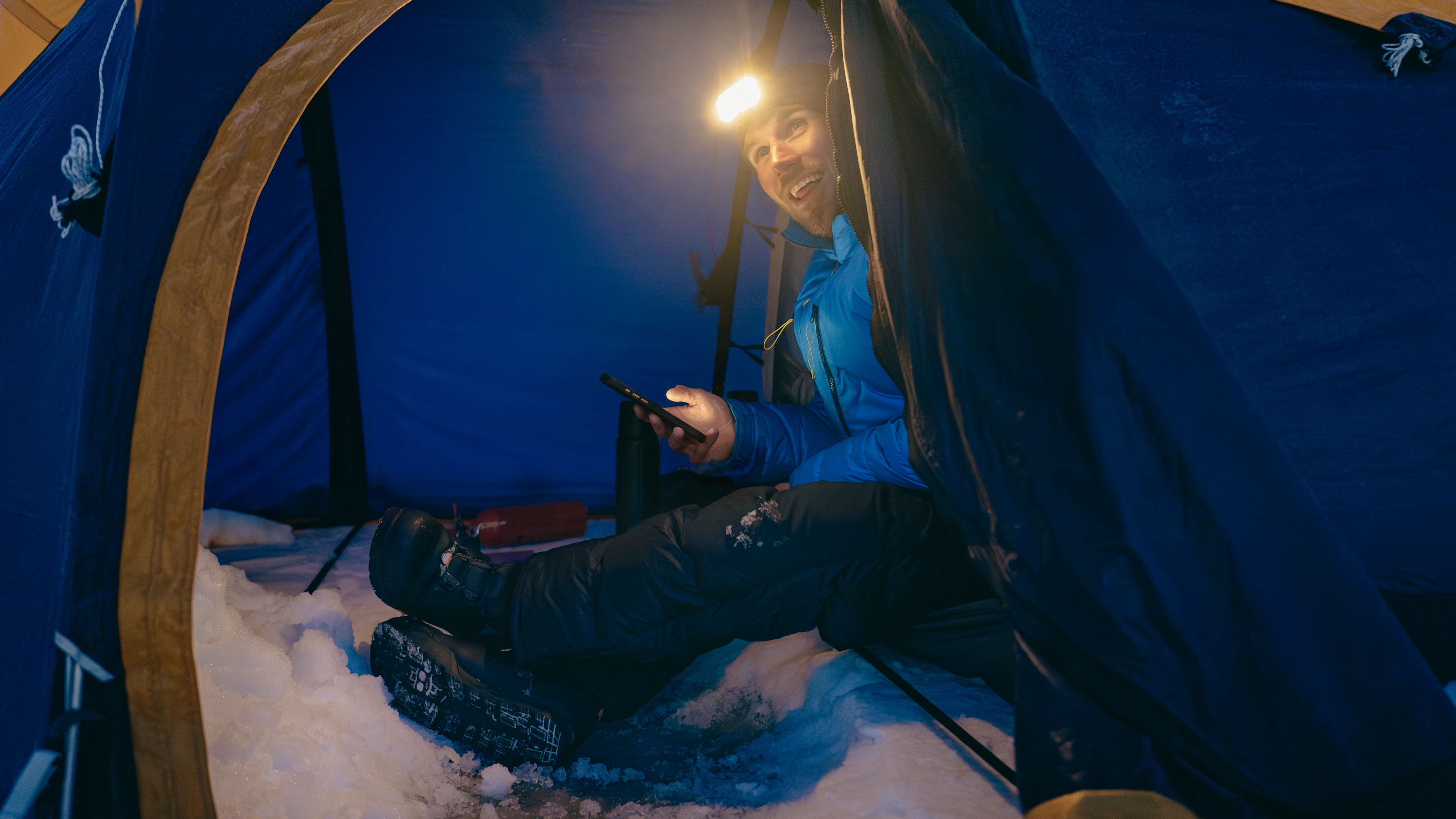 James smiles from inside his tent during training in Iceland.