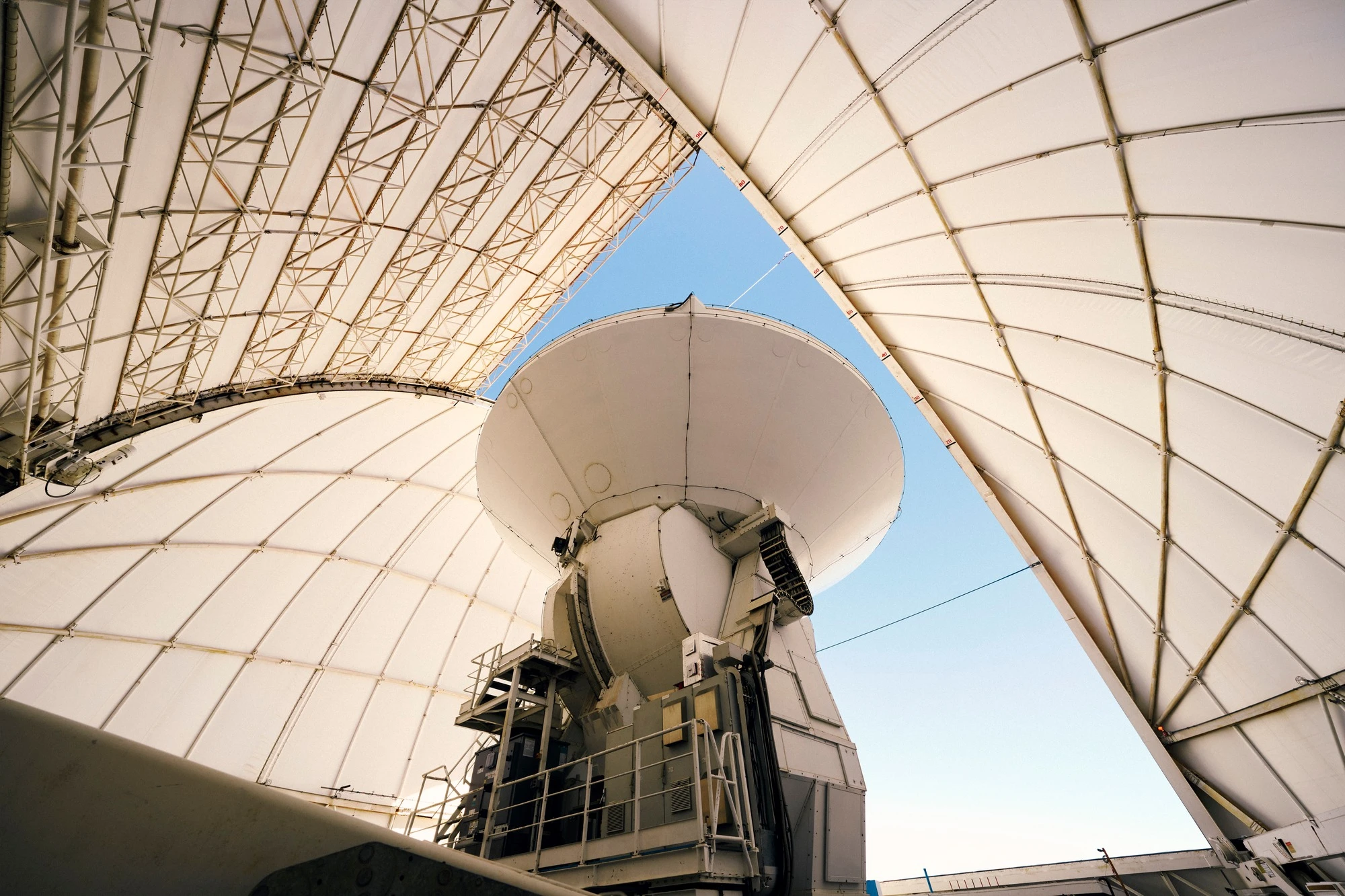 The inside of a radio telescope dish viewed from below.