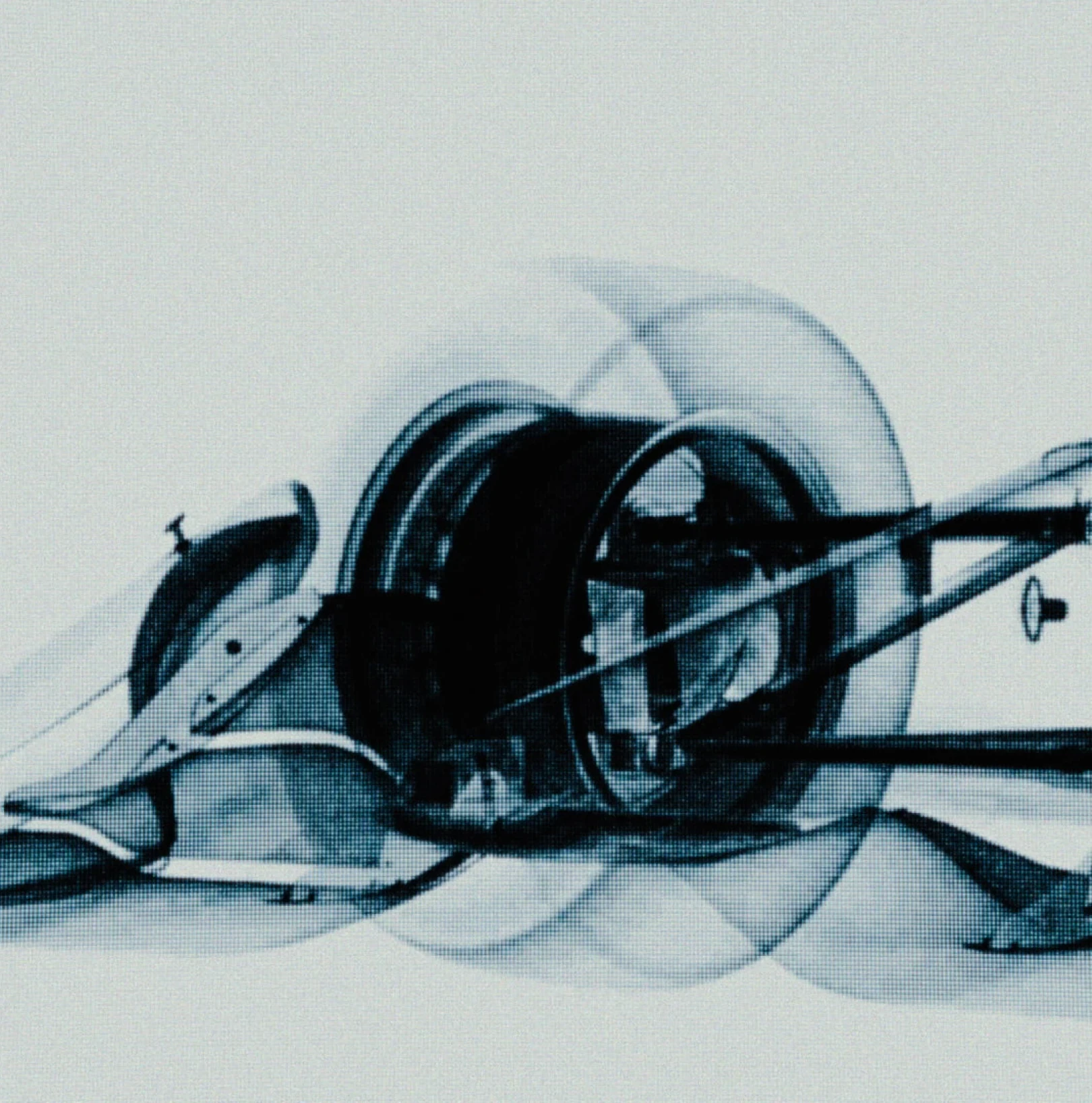 A stylized visualization of the front wheel and suspension of a race car.