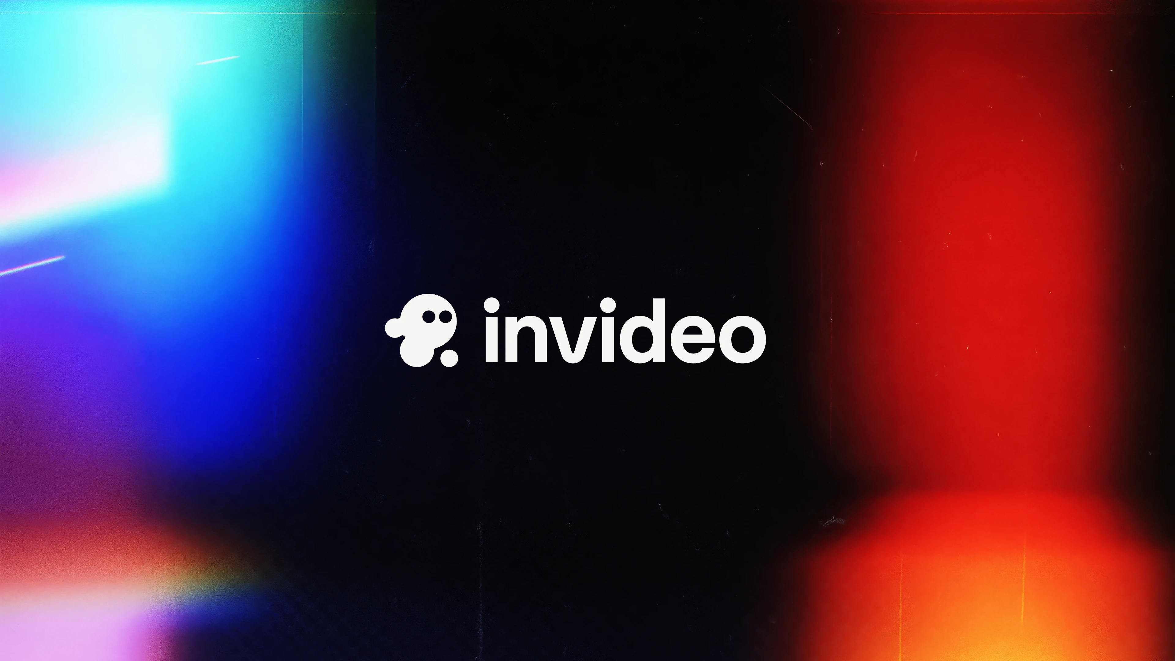 Invideo logo in white centered on a dark background with vibrant blue and red light flares on the sides.