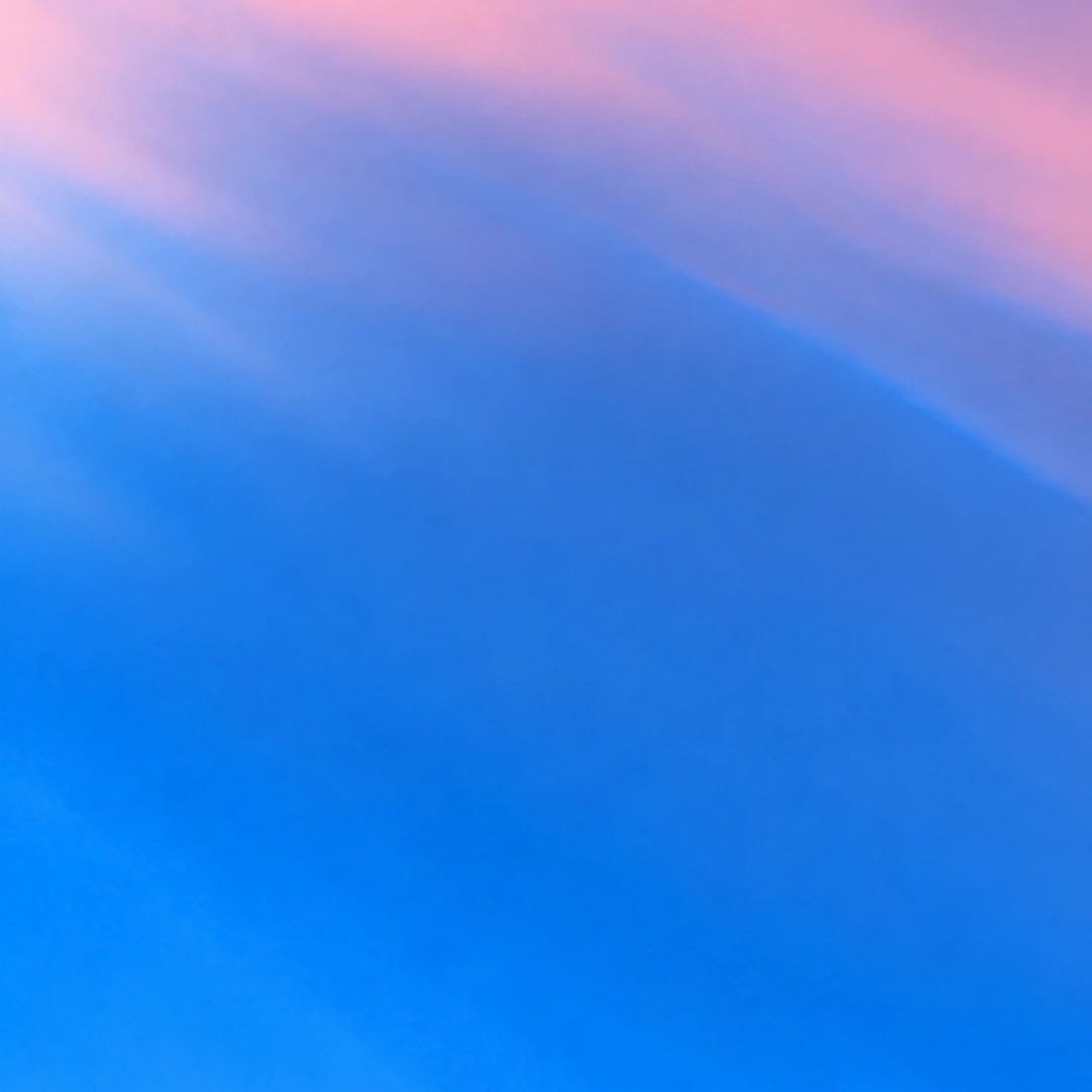 Abstract blue artwork with soft pink and lavender accents.