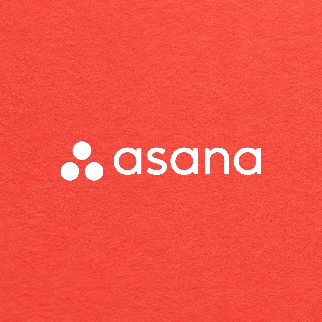 Asana logo on a red textured background.