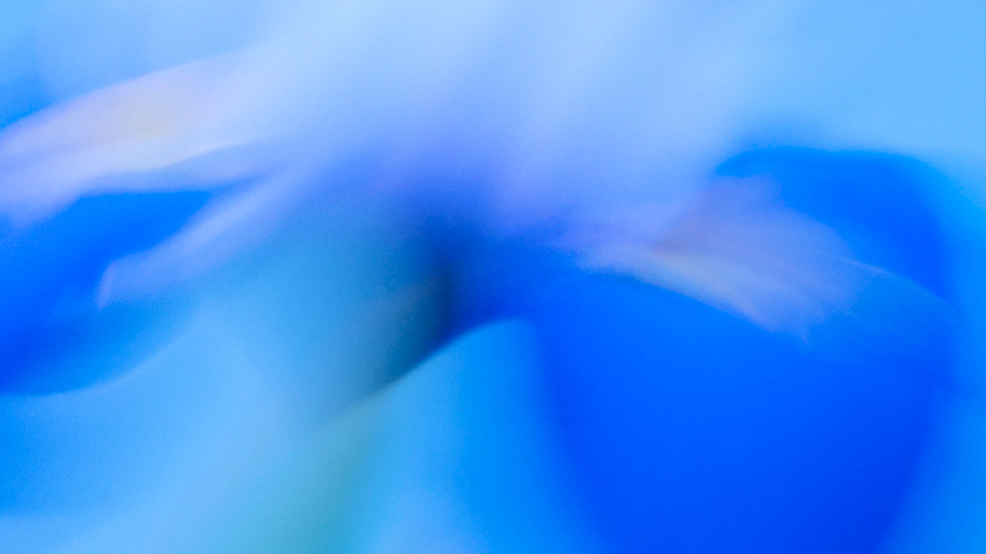 Abstract blue motion blur with hints of purple and soft flowing shapes