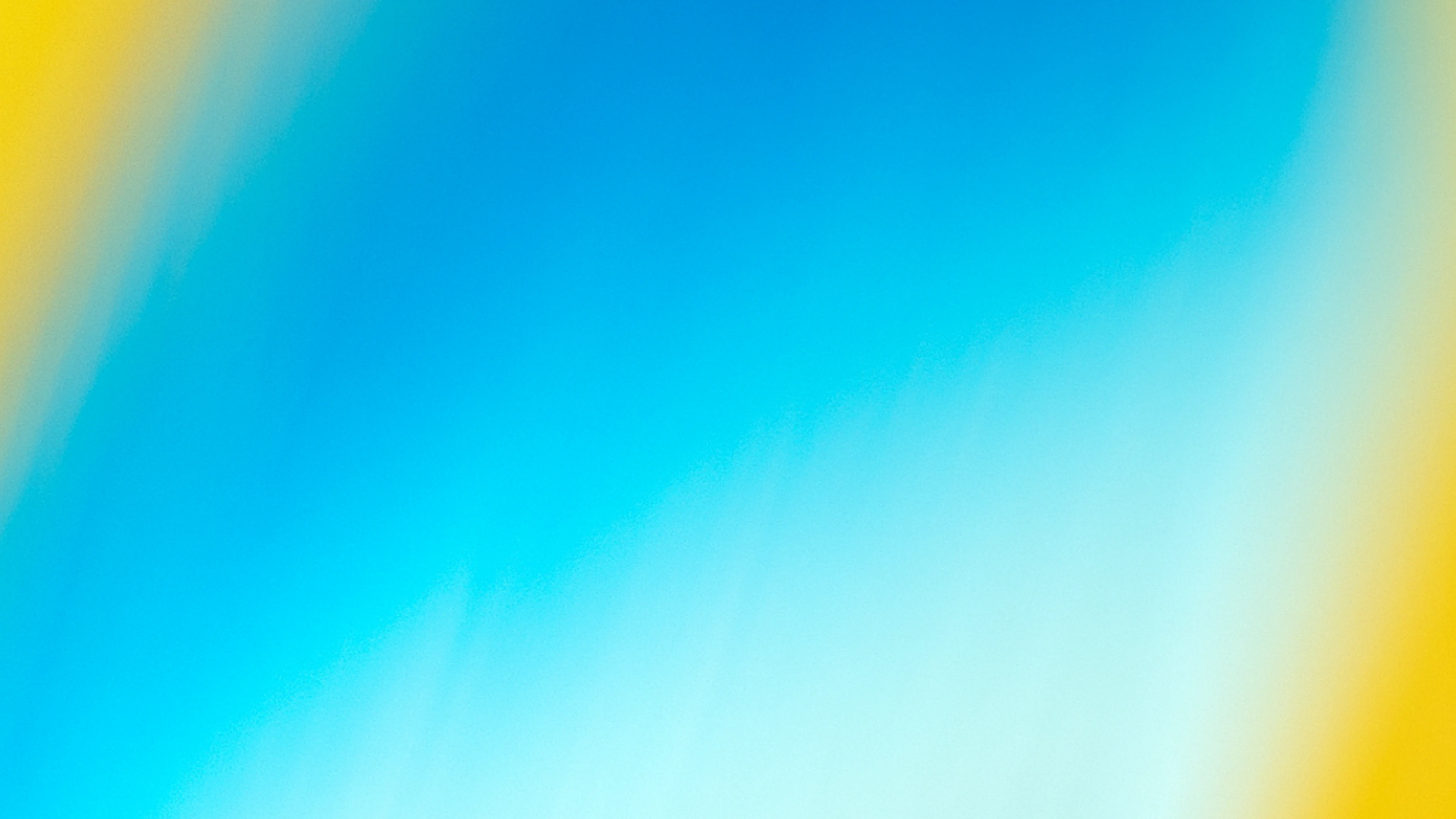 Abstract image with bright gradients of blue, yellow, and light turquoise blending diagonally, evoking warmth and movement.