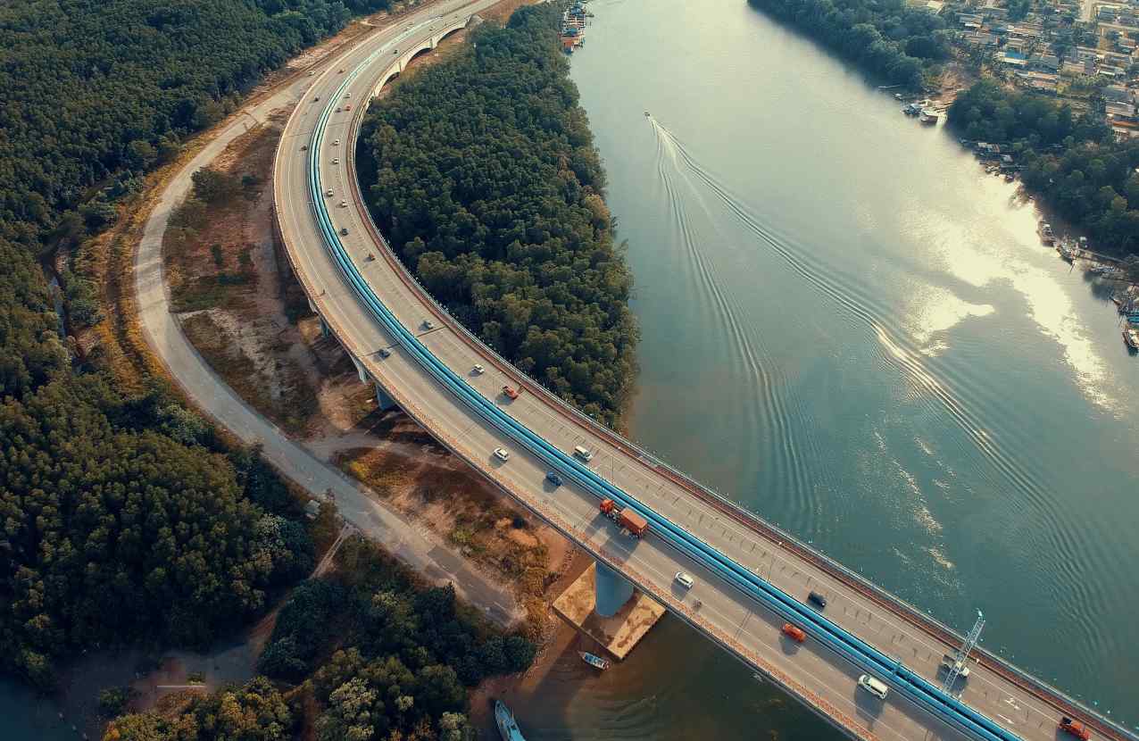 A highway passing over a river and through the forest.