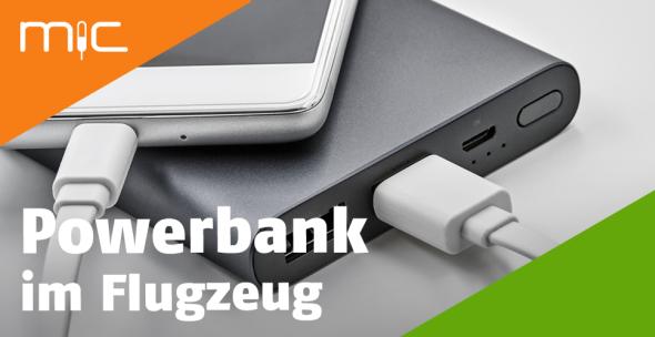 Ein Smartphone wird mithilfe einer powerbank aufgeladen.