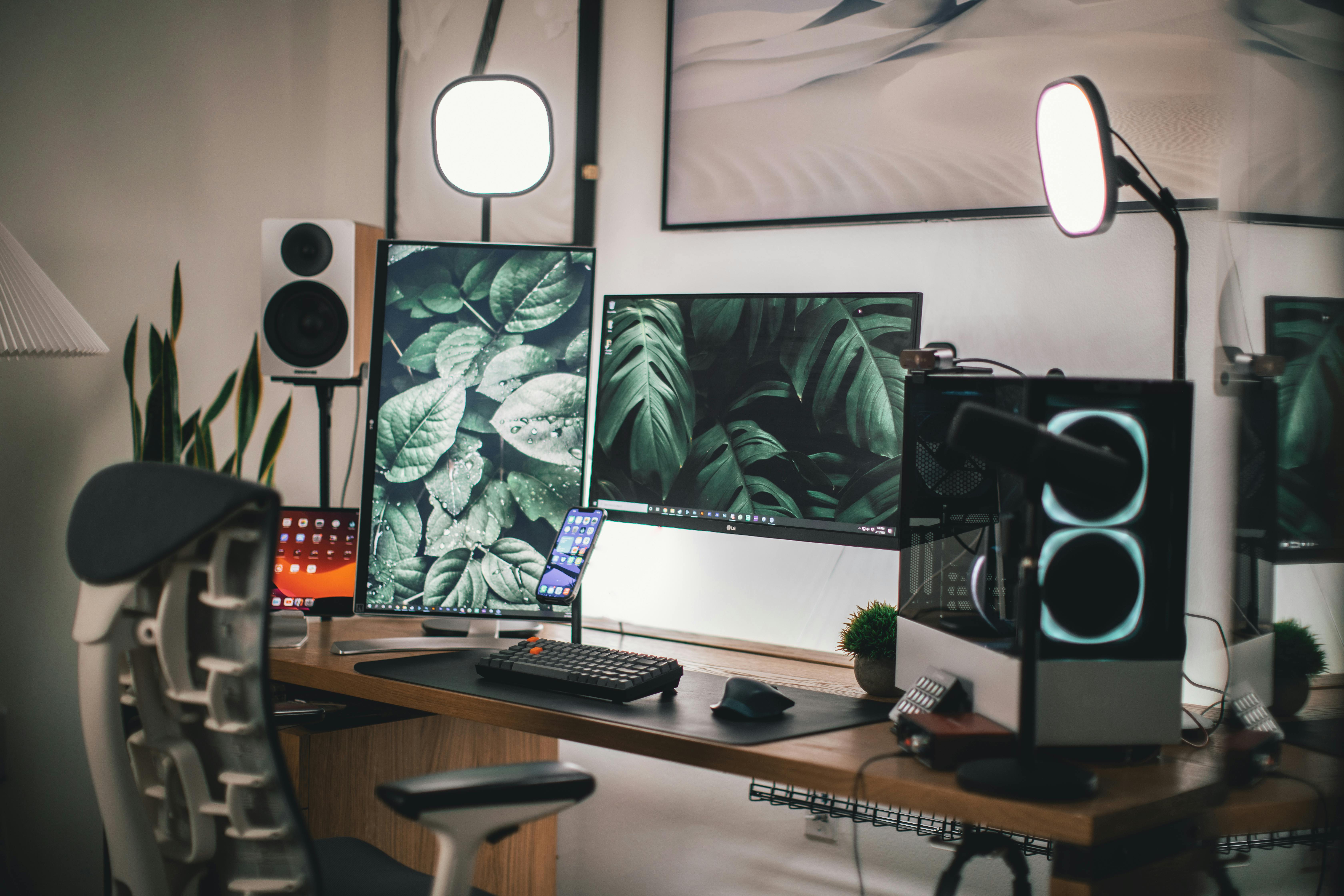 A home office with a laptop and multiple monitors