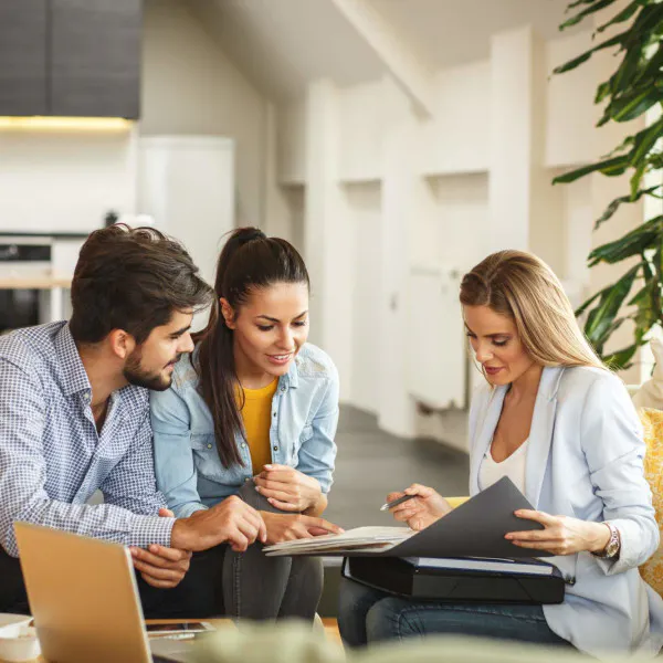 Agent helping young couple