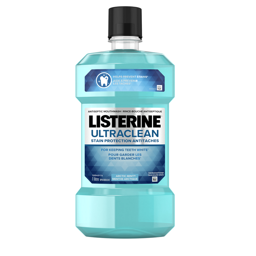 A bottle of LISTERINE Ultraclean® Stain Protection Mouthwash, 1L with a logo of the Canadian Dental Association approval in the background.