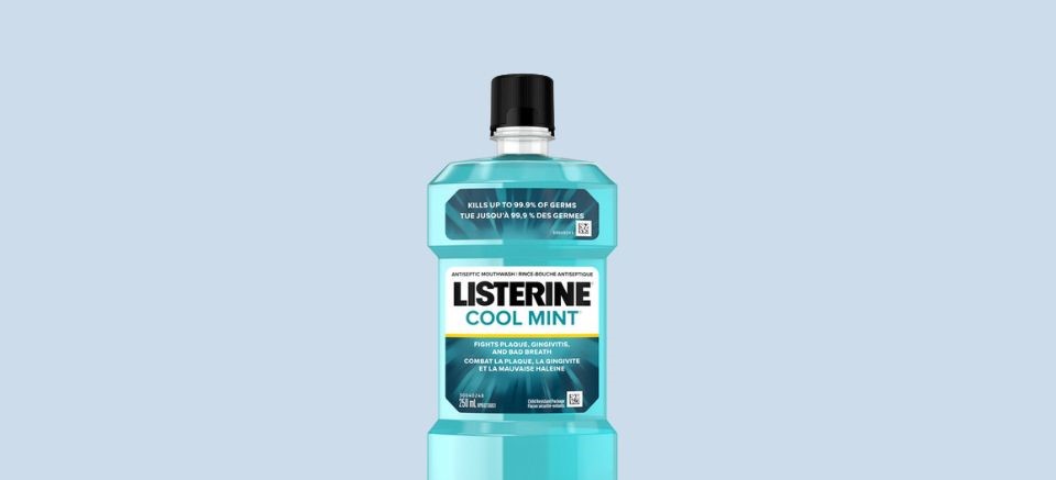 Listerine mouthwash bottle against turqouise background