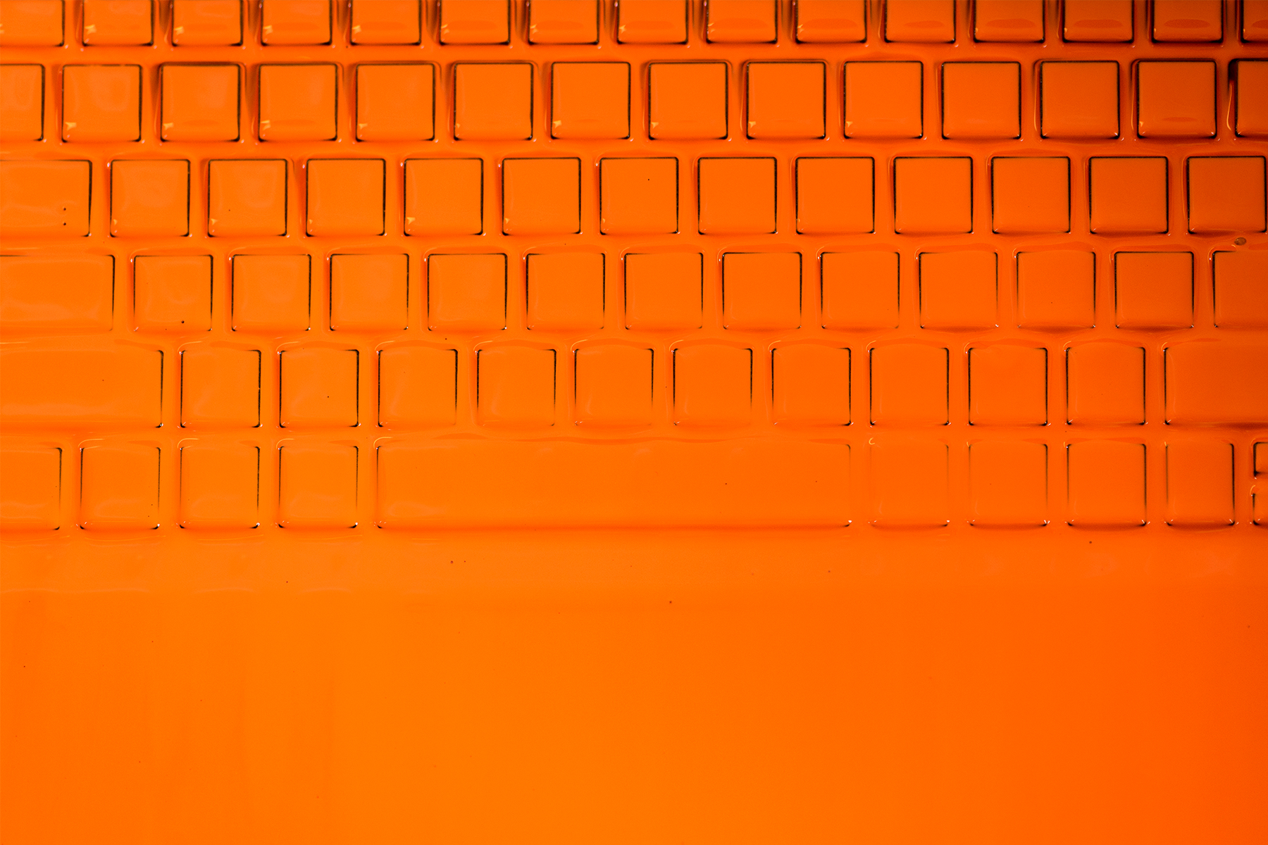 Keyboard covered with orange paint