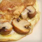 Cheddar Omelet with Sautéed Onions and Shiitake Mushrooms 