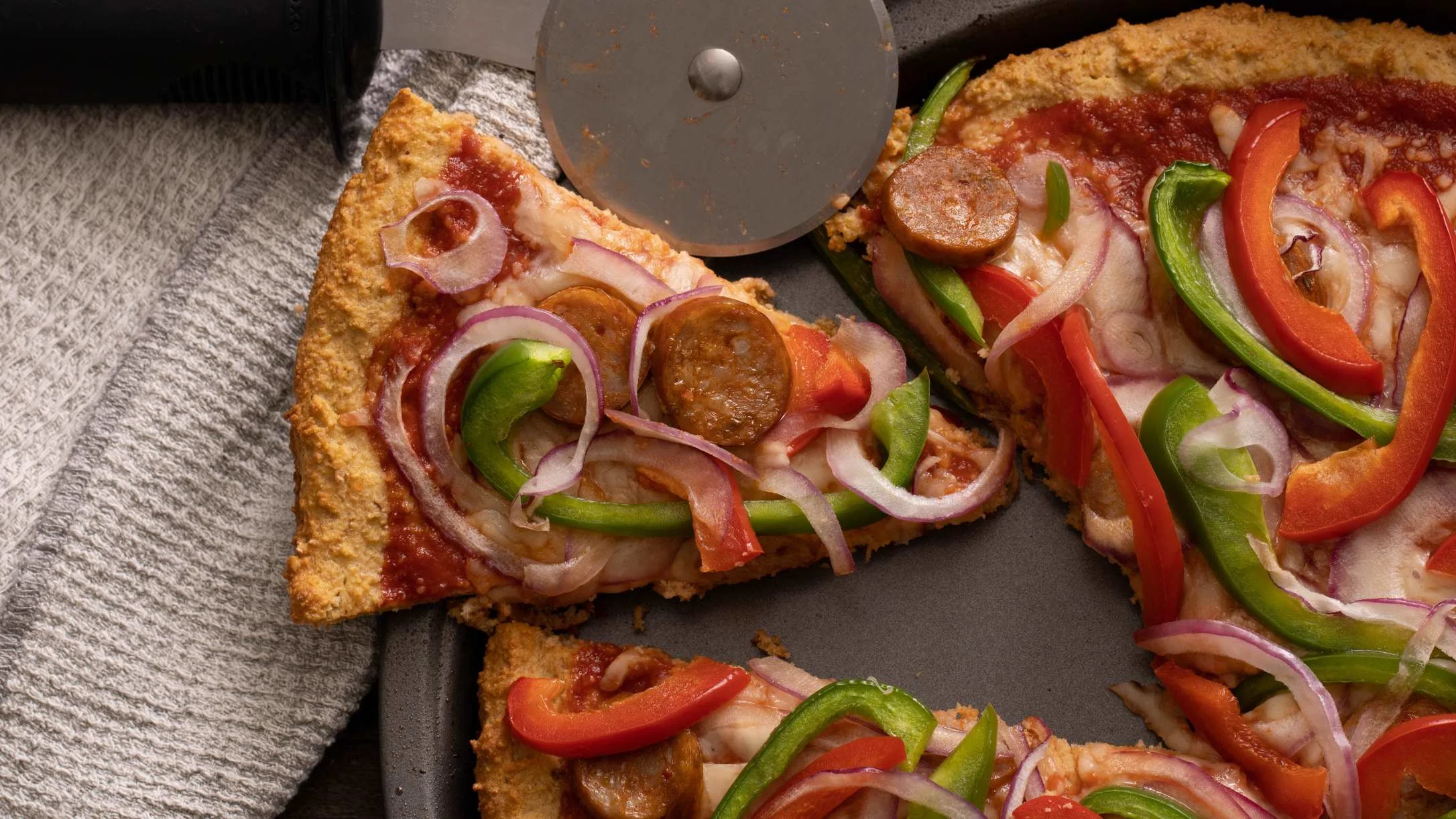 atkins pizza with sausage bell peppers and onions
