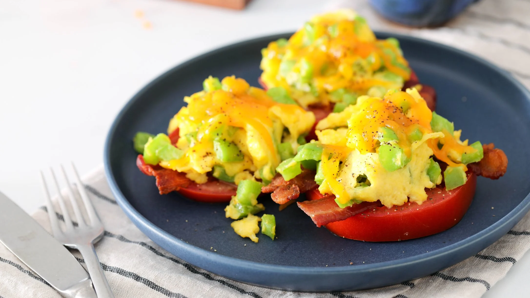 scrambled-eggs-with-bacon-green-bell-peppers-and-tomato 1