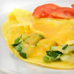 Cheddar Omelet with Sautéed Tomato and Zucchini