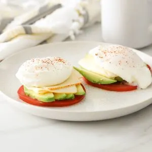 Poached Eggs over Tomato, Avocado and Muenster