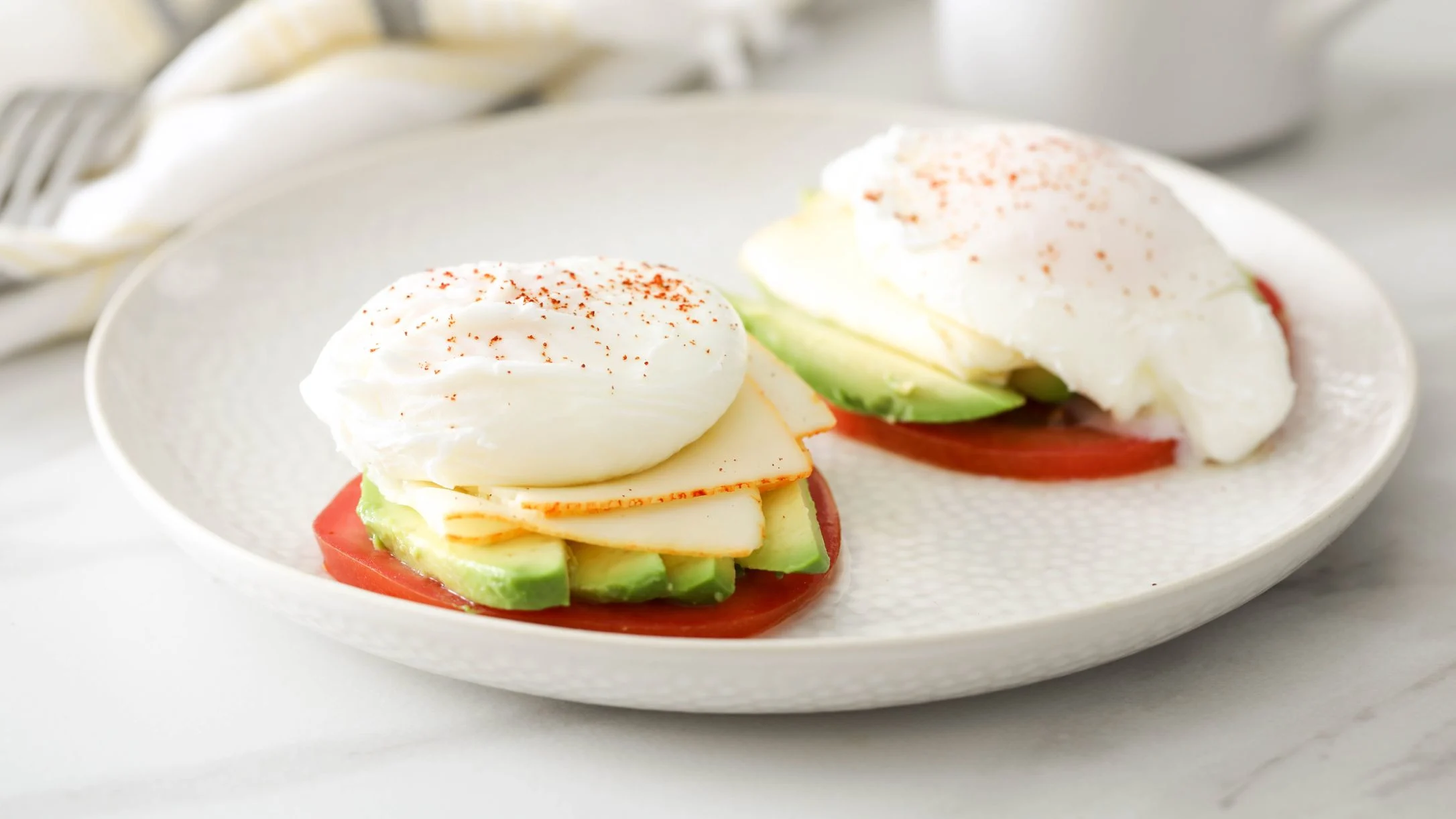 poached-eggs-over-tomato-avocado-and-muenster