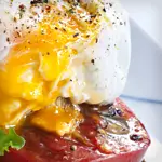 Keto Poached Eggs with Cheddar and Tomato