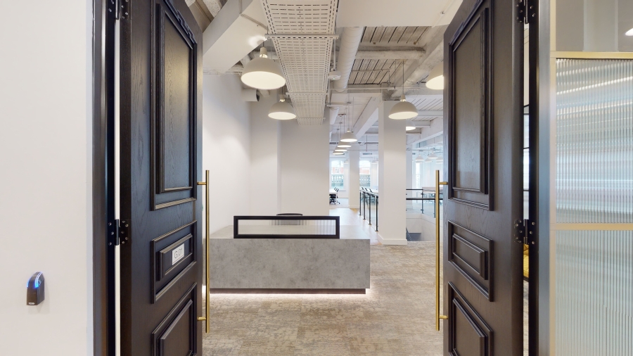 View through large brown doors into fitted managed office space at Louisa Ryland House