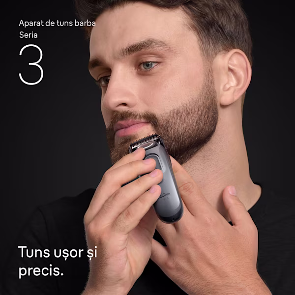 Tânăr care își tunde barba de pe bărbie cu aparatul de tuns barba Braun Seria 3 Tânăr care își tunde barba de pe bărbie cu aparatul de tuns barba Braun Seria 3