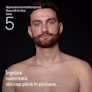 Tânăr cu barbă, fără cămașă, după utilizarea setului Aparatul de tuns multifuncțional All-in-One Braun Seria 5 Tânăr cu barbă, fără cămașă, după utilizarea setului Aparatul de tuns multifuncțional All-in-One Braun Seria 5