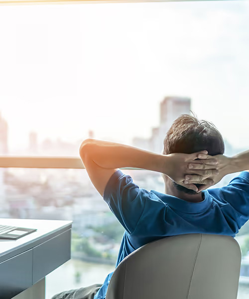 A man looks out his office window