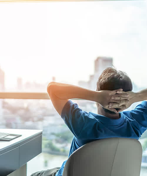 A man looks out his office window