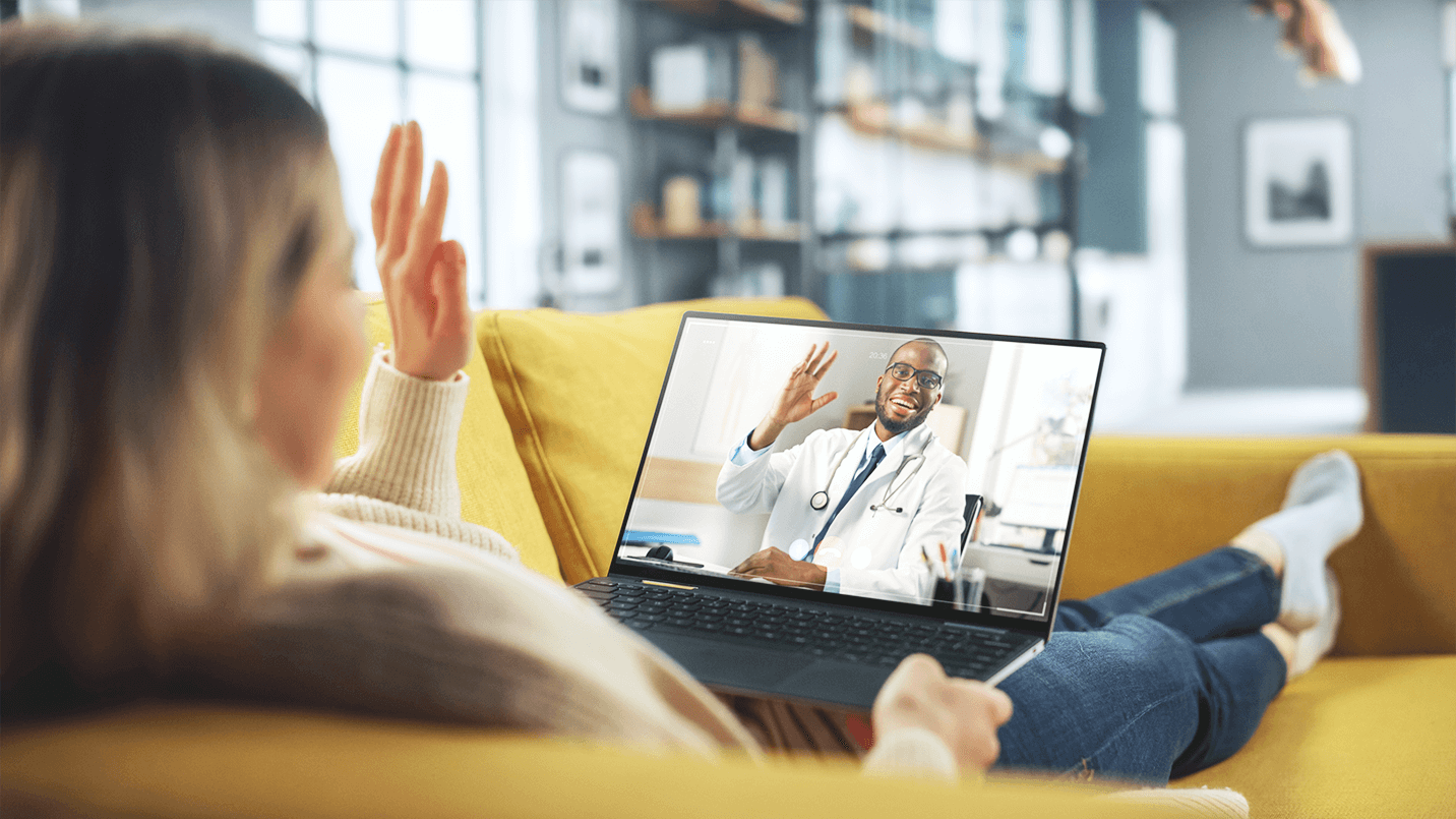 woman talking to male doctor on video conference