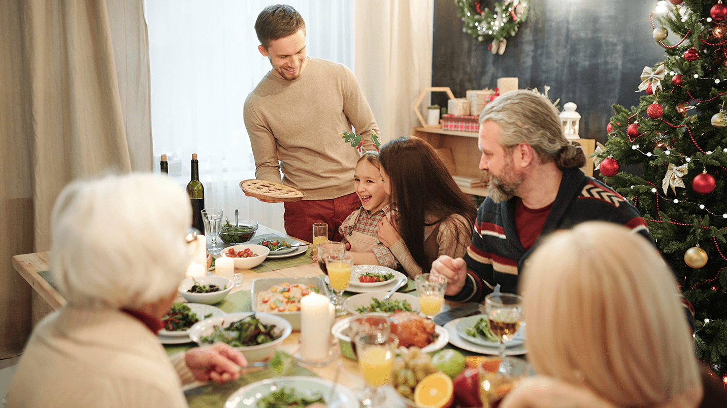 family sitting down for Christmas dinner