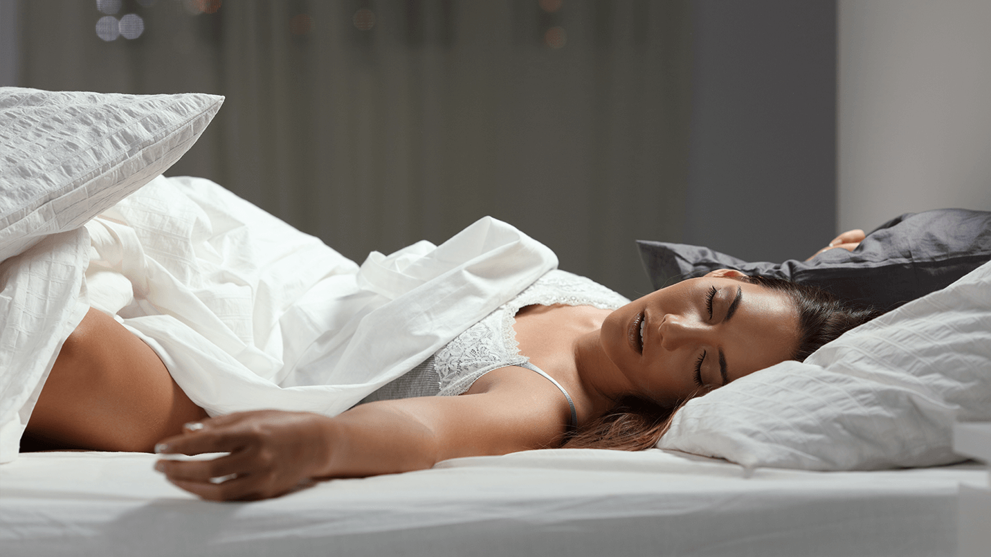 woman laying in bed in a deep sleep