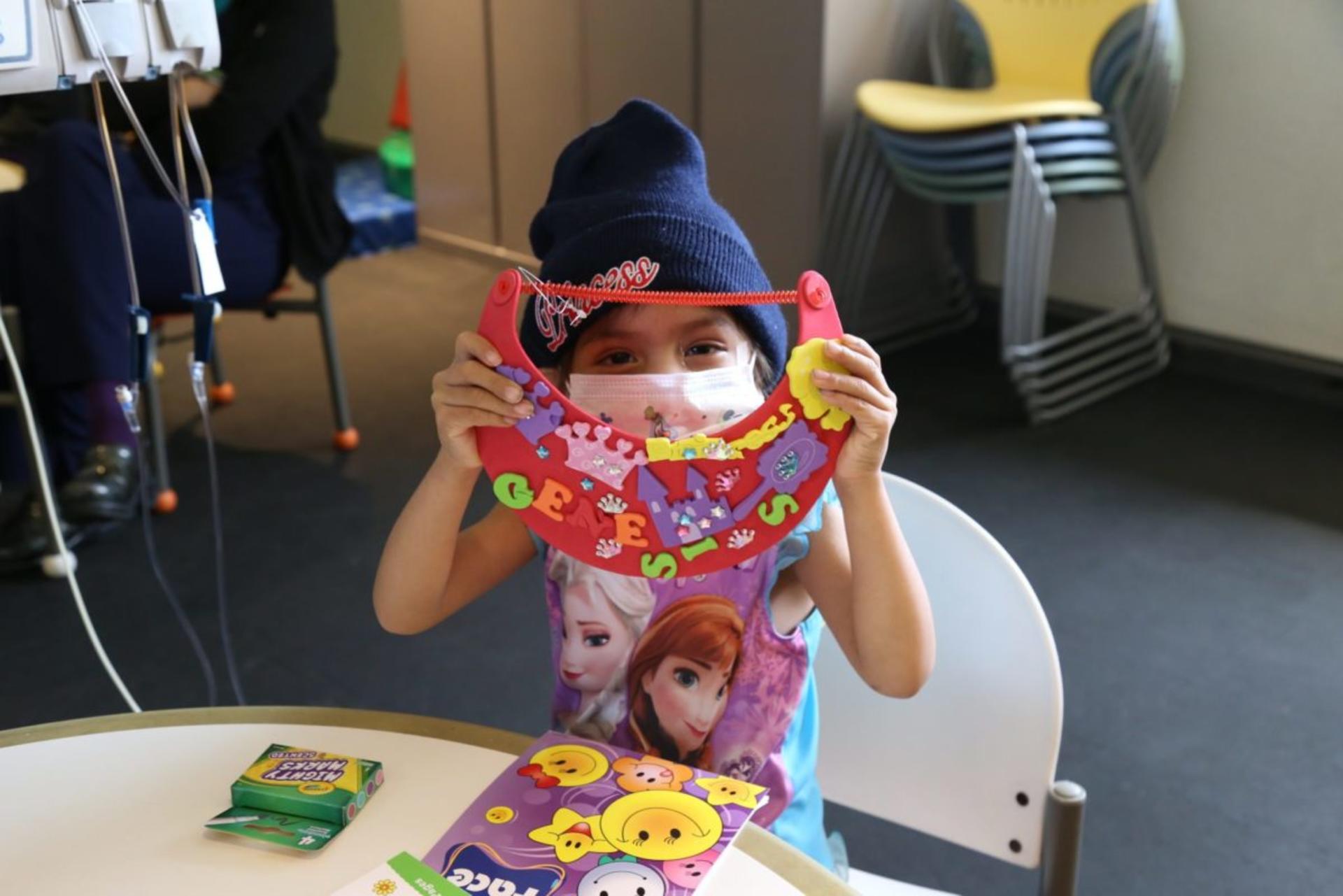 Genesis, age 3, playing with arts and crafts delivered by Michaels (Michaels delivered nearly 30,000 of these backpacks to hospitalized kids across the nation)