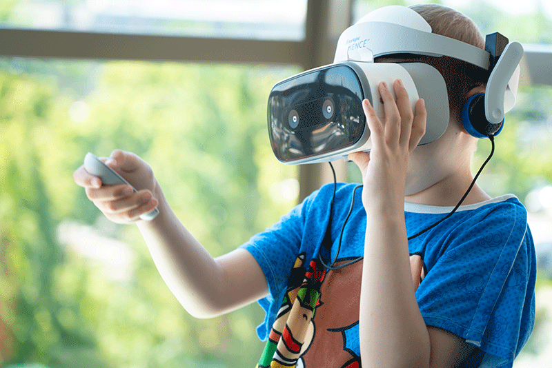 Boy playing Virtual Reality 