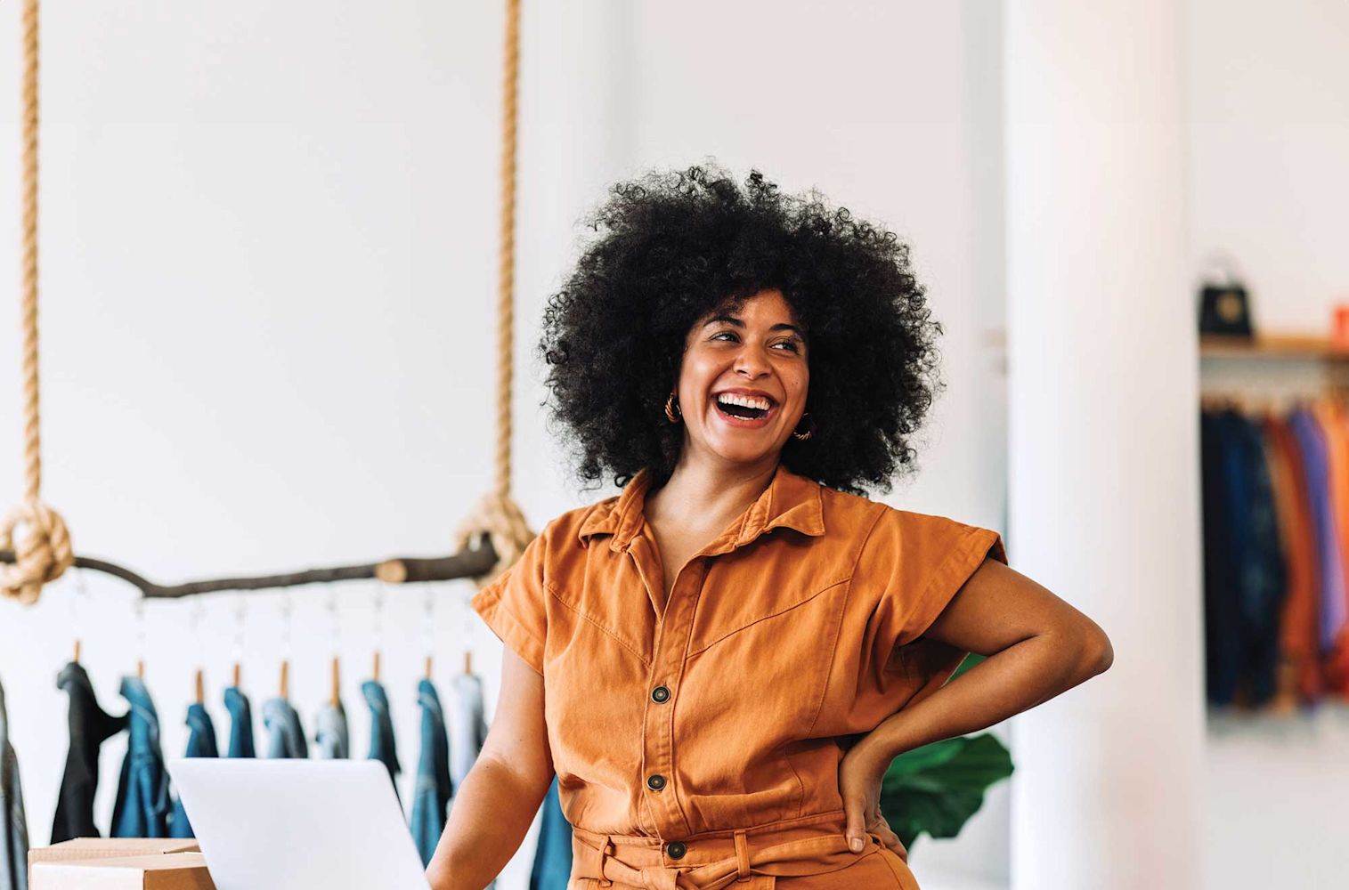 Your Credit Union for What's Next, business Woman smiling at computer