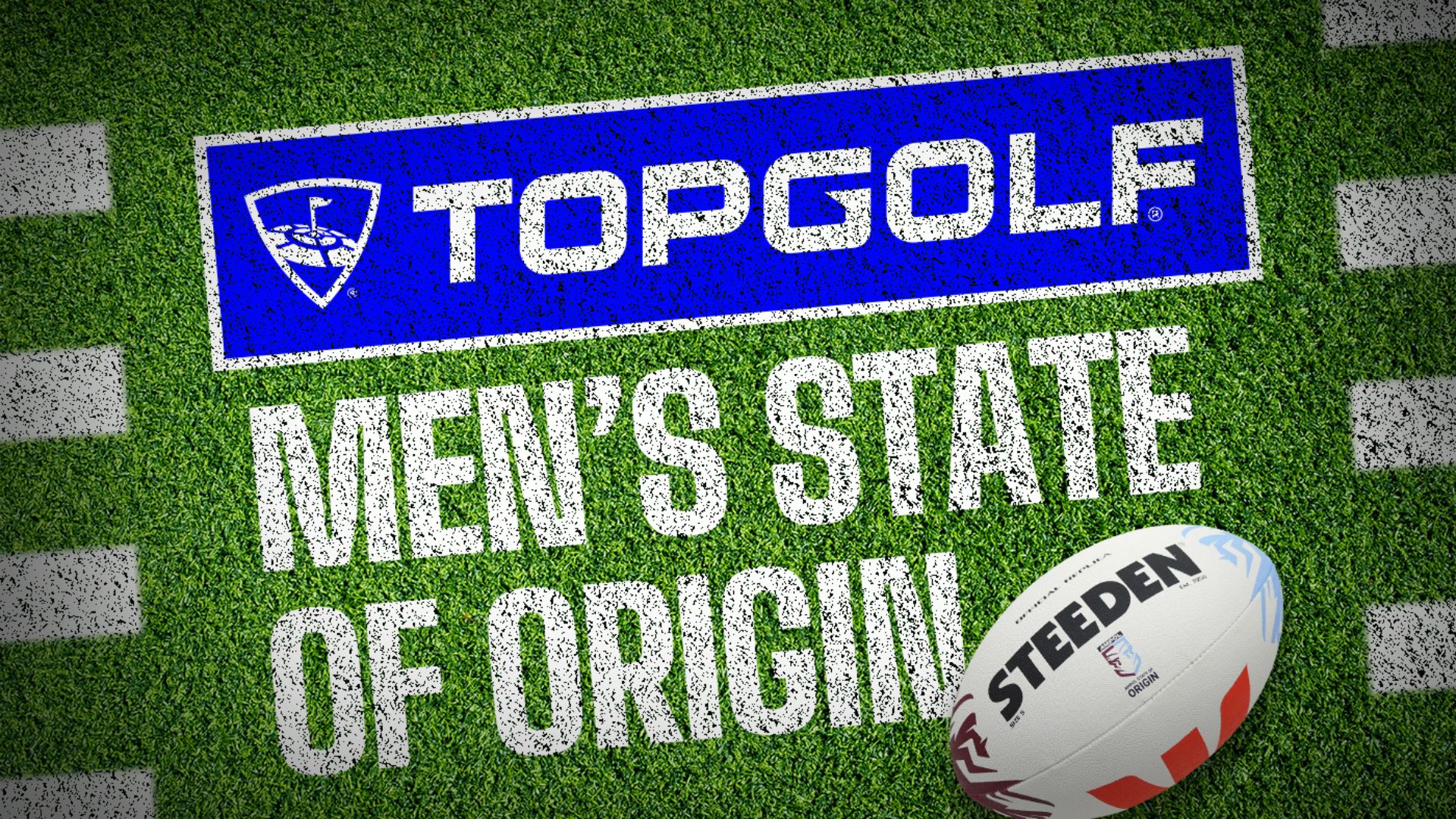 A close-up of a football field with "TOPGOLF MEN'S STATE OF ORIGIN" written on the turf and a Steeden rugby ball resting on the right side.