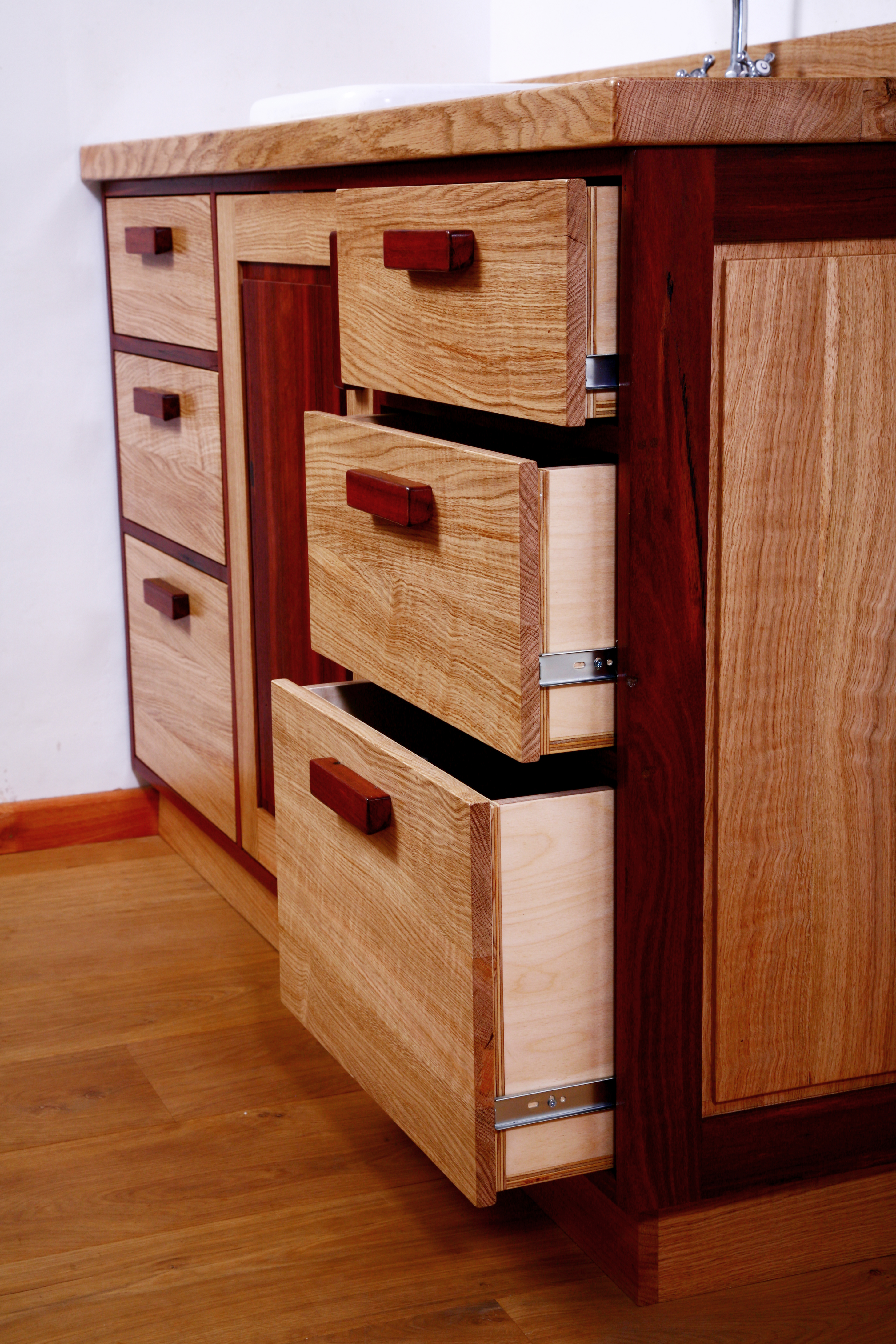Drawers in an Oak and Purple Heart cabinet